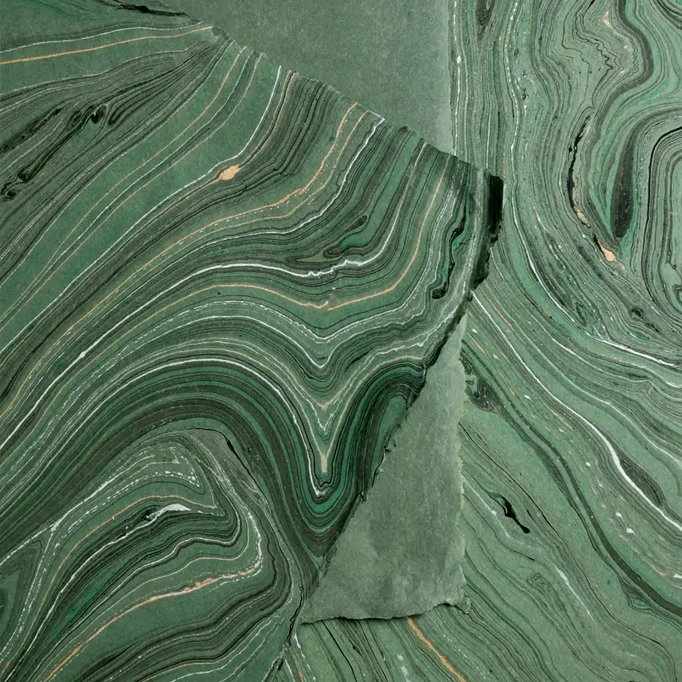 Handmade Marbled Paper- Dark Green with Black, Silver, Gold showing front and back sides with edge deckle
