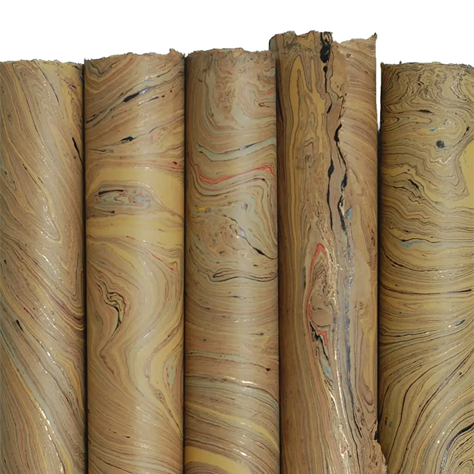 Handmade Marbled Paper- Tan with Gold, Red, Blue 5 sheets rolled to show pattern variations