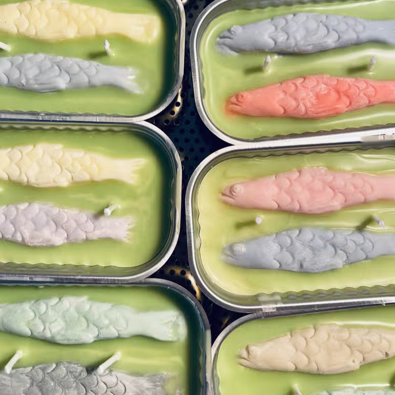 The Original Tinned Fish Candles shown open with two colorful fish - 6 cans shown