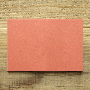 TRAVELER'S FACTORY Passport Refill features pink kraft paper. 
