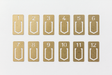 TRAVELER'S COMPANY Brass Number Clips comes with 12 clips. 