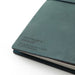 Each Blue Edition Midori Traveler's Notebook is branded with the logo and make information. 