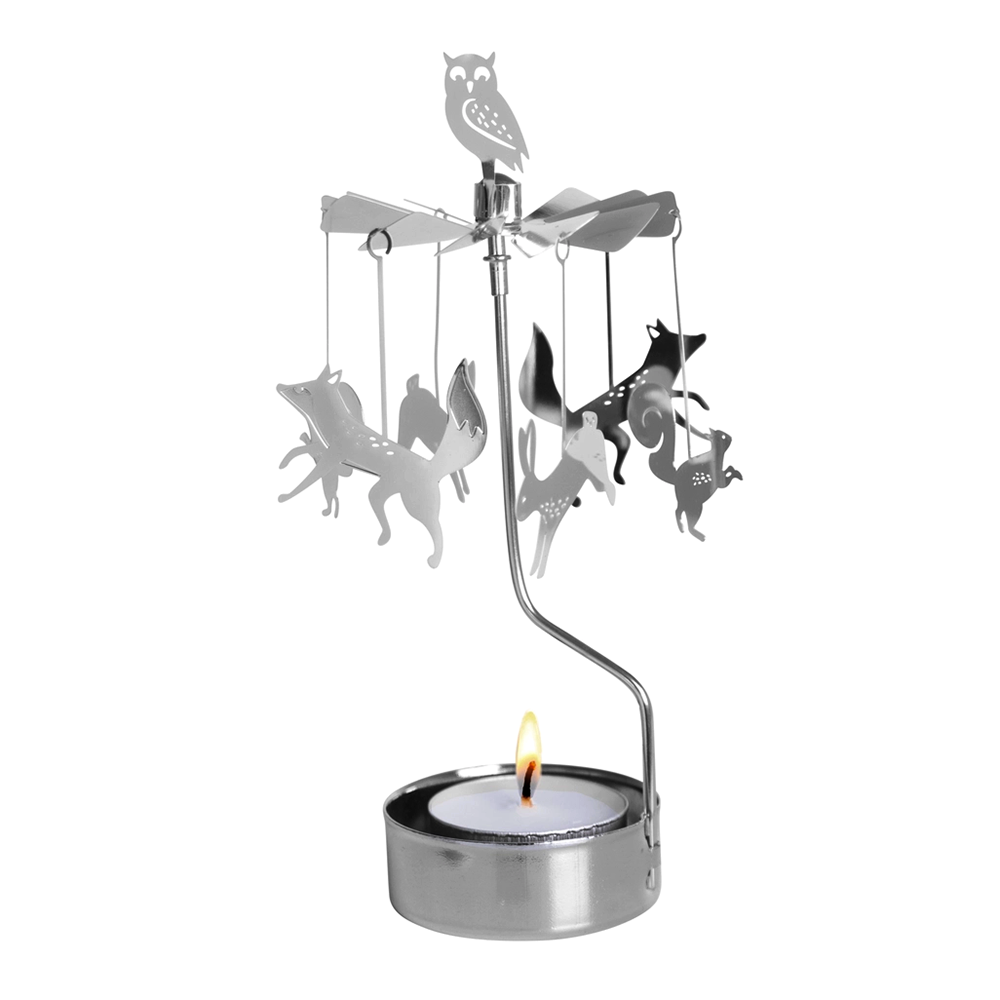 A silver metal animal mobile candle holder with an owl at the top and hanging fox, rabbit, and squirrel silhouettes, lit with a small tea light candle on a white background.