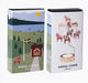 Two product boxes for Angel Chime Dala horse candles shown on a light gray background. One box features a colorful illustration of a Swedish landscape with a red house, trees, lake, and flag, while the other shows the white candle holder design with a red dala horse on a metal stand.