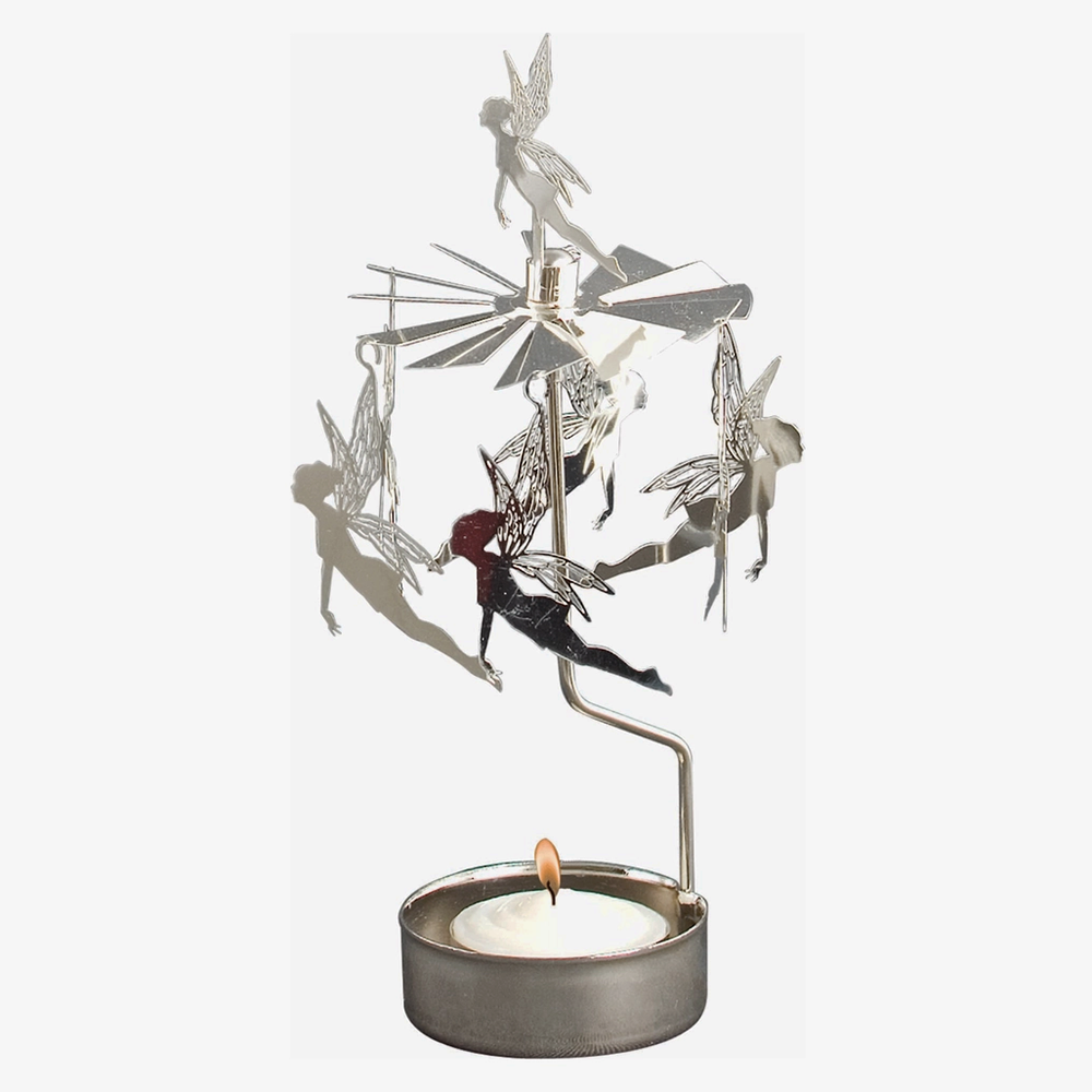 A silver-toned metal fairy spinner candle holder featuring multiple flying fairy cutouts and a small tealight candle in a round metal base, shown against a plain white background.
