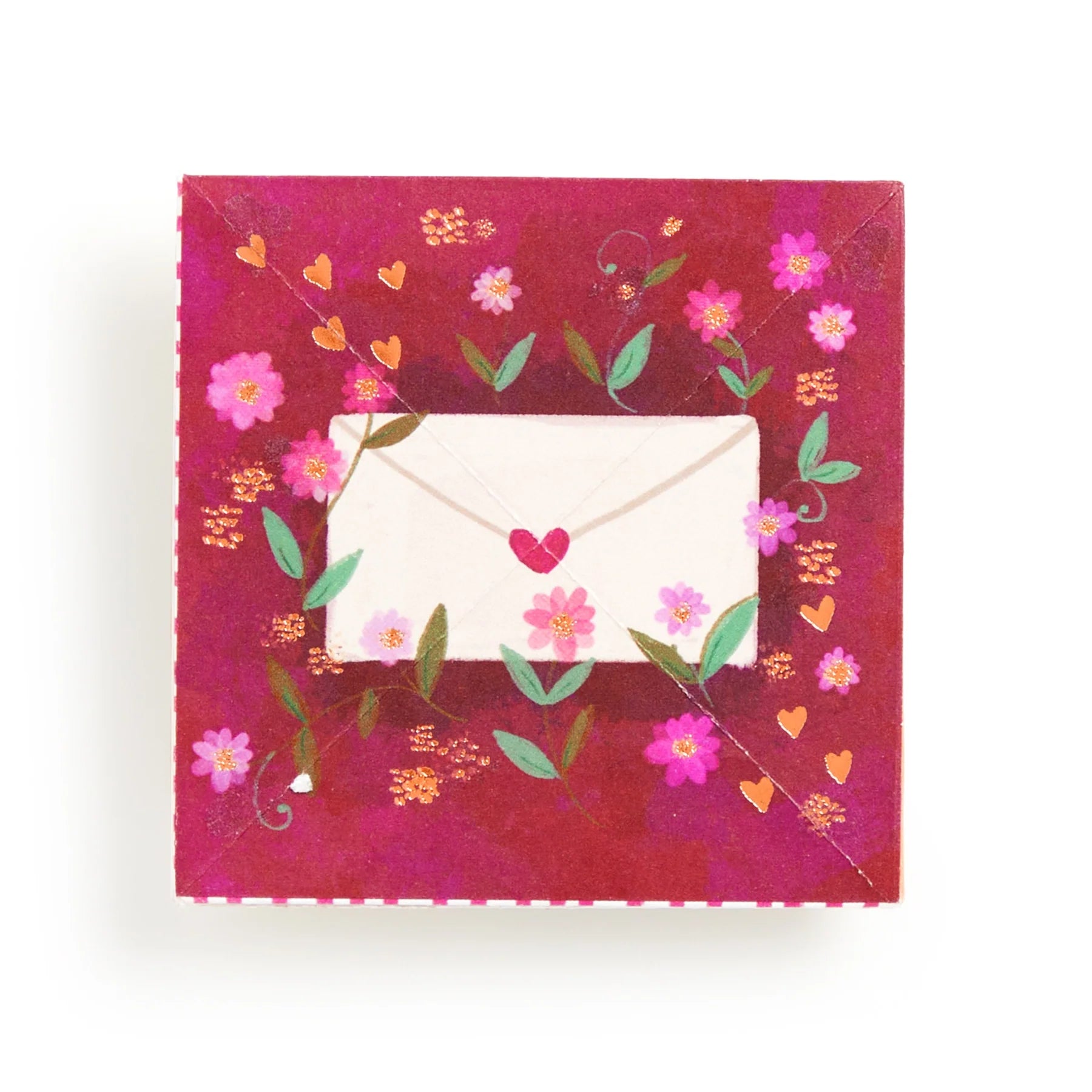 Decorative card with floral design and envelope on a red background
