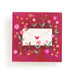 Decorative card with floral design and envelope on a red background
