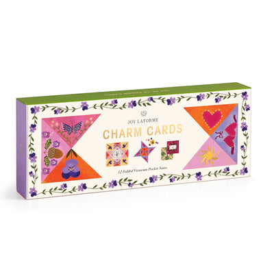 Box of Joy Laforme charm cards with colorful designs on a white background