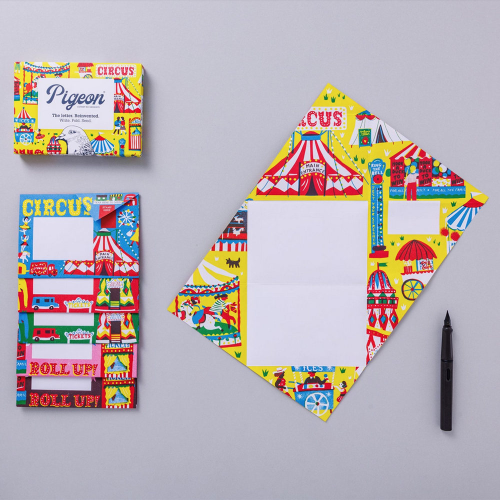 Colorful circus-themed stationery set on a gray background