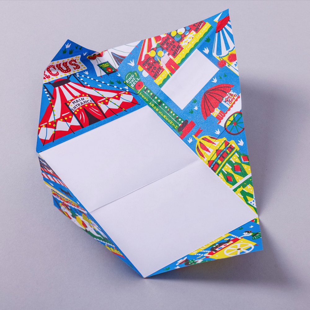 Colorful writing sheet with circus-themed pattern on a gray background