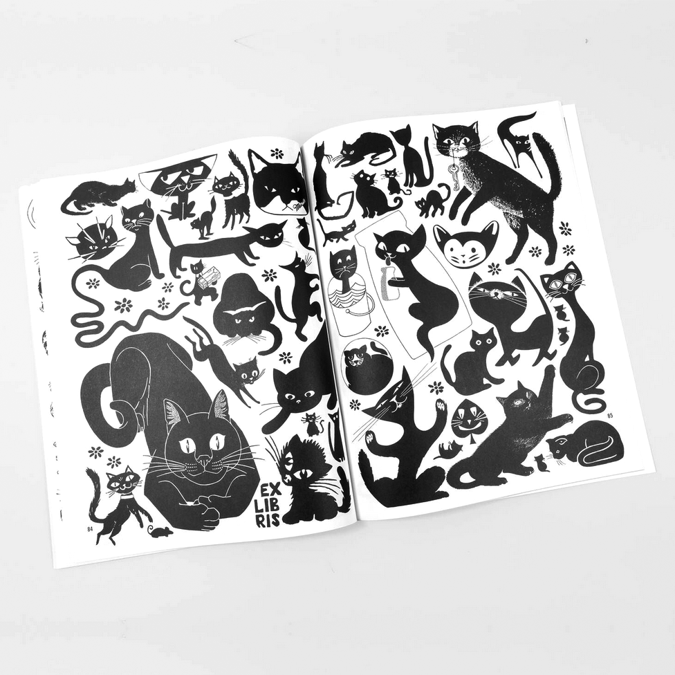 Open book of black cat illustrations on a white background