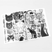Open book displaying black and white cat illustrations on a light gray background