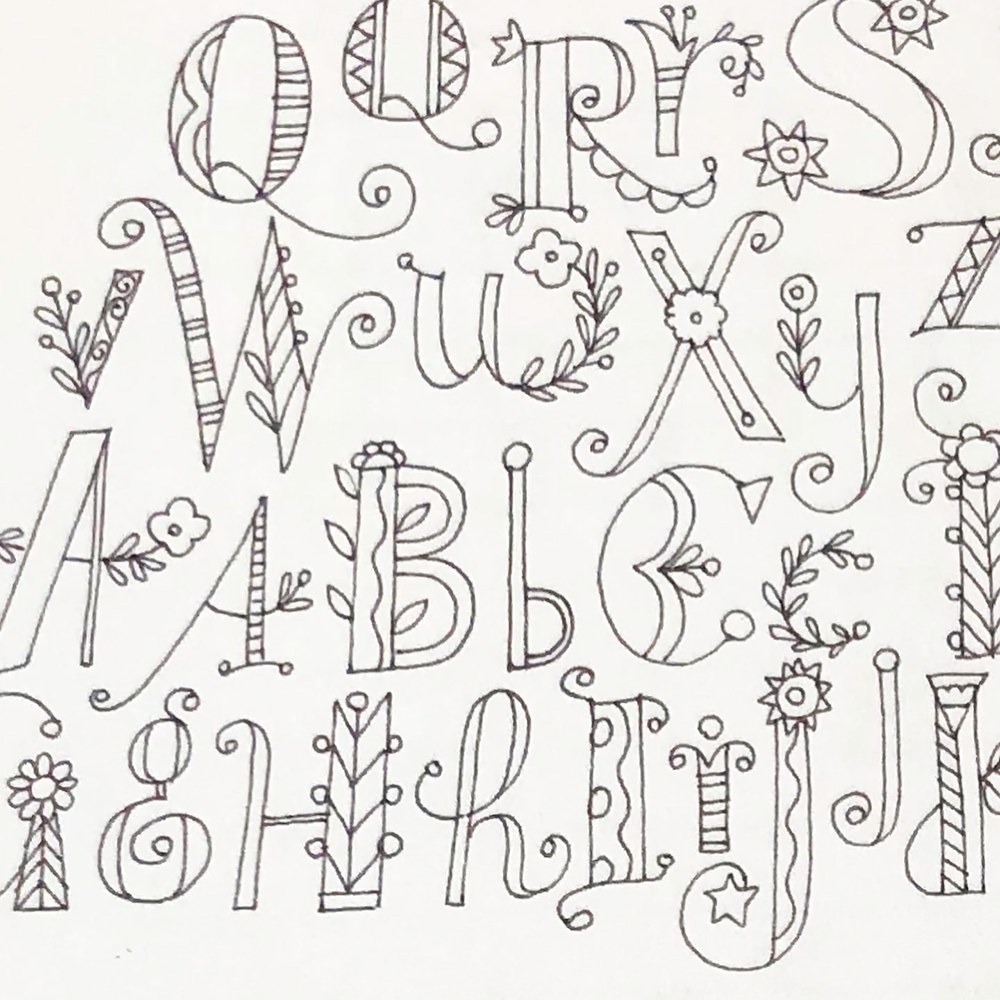 Alphabet letters with decorative elements on a white background