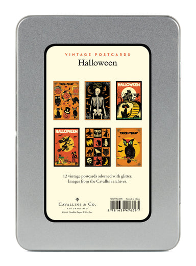 A silver metal tin containing vintage Halloween postcards, shown from the back. The back features a cream-colored label with six colorful Halloween-themed postcard designs, including a skeleton, a witch, and a cat under a full moon.