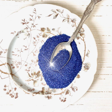 Authentic German Glass Glitter- Royal Blue on plate with spoon