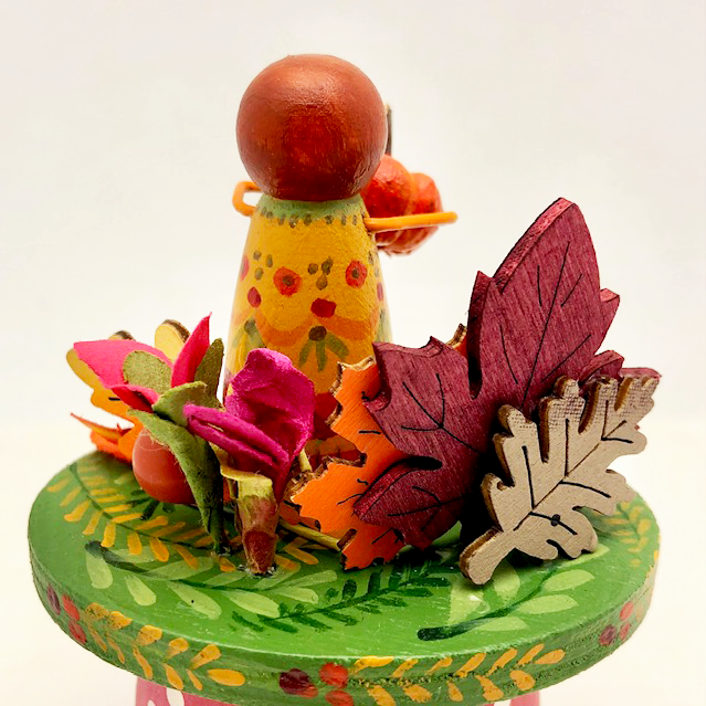 Harvest Girl Class sample- back side with peg doll, leaves, and wooden base