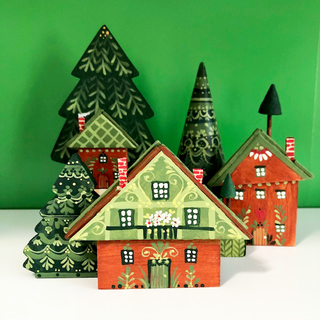 Alpine Village class samples- 3 houses 3 trees on green background