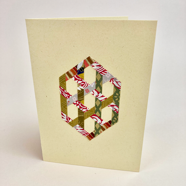 Card with woven hexagon geometric paper design on a beige background