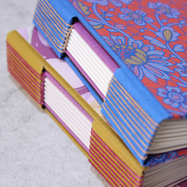 Buttonhole Binding class samples showing spine details and cover patterns
