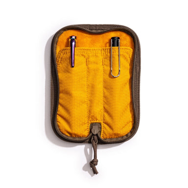Lochby Duo Pen Pouch brown in color shown lying open with yellow interior and two sample pens (not included) show in pouches