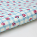 Floral-patterned paper with pink flowers on a blue and white checkered background- detail