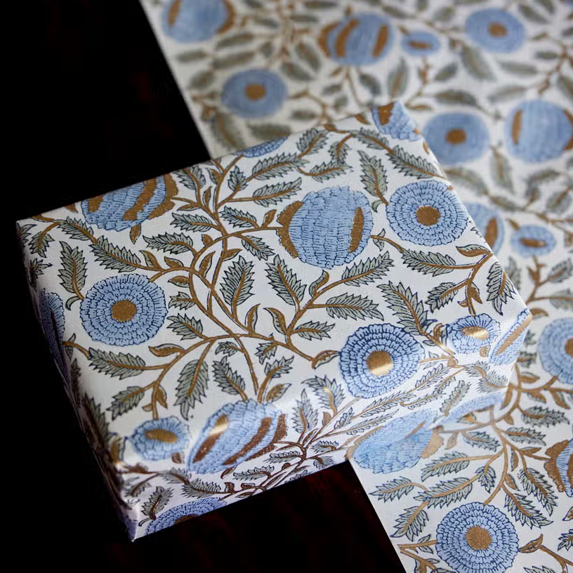 Handmade Indian Cotton Paper- Block Printed Marigold floral pattern with blue flowers and gold vines used on wrapped package with flat sheet