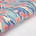 Marbled paper with pink and blue patterns on a white background