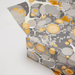 Handmade Indian Cotton Paper- Marbled Stone- Slate with ciruculare marbled patterns- with gray and gold accents shown as a wrapped package and with flat sheet
