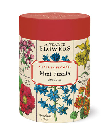  cylindrical puzzle box with floral design and 'A Year in Flowers' text