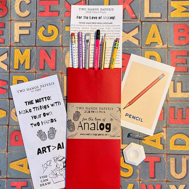 THP 2026 Limited Edition Pencil Pack- packaging, info card and pencils shown in envelope on alphabet paper