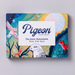 Pigeon letter writing kit packaging with illustrations of birds and text on a gray background