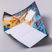Colorful patterned origami folded letter shown open with nature-themed design on a light gray background