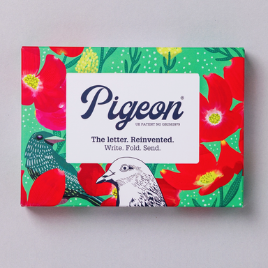 Pigeon product packaging with floral design and text on a gray background