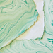 Handmade Marbled Paper- Mint Green with Cream and Gold showing front and back sides with edge deckle