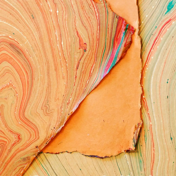 Handmade Marbled Papers- Orange with Green, Red, Gold showing front and back sides with edge deckle