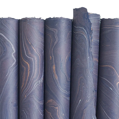 Handmade Marbled Paper- Dark Purple with Ochre and White 5 sheets rolled to show pattern variations