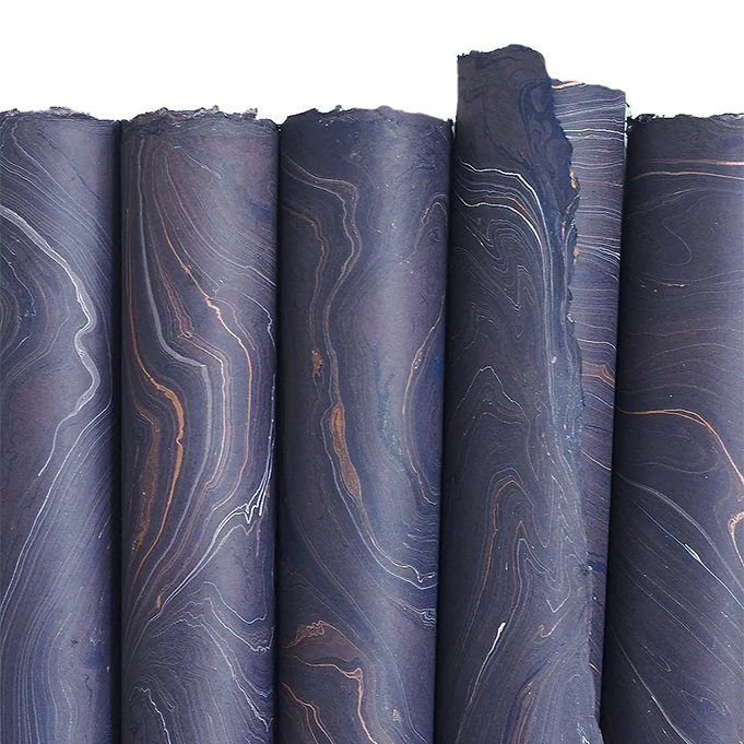 Handmade Marbled Paper- Dark Purple with Ochre and White 5 sheets rolled to show pattern variations