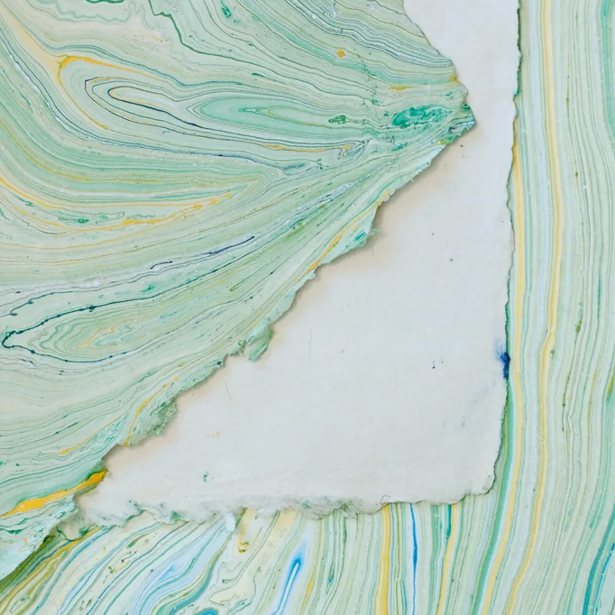 Handmade Marbled Paper- Green and Blue with Silver and Yellow showing front and back sides with edge deckle