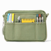 An olive green canvas pouch with multiple front pockets holding pens, a yellow notepad, shown on a white background.