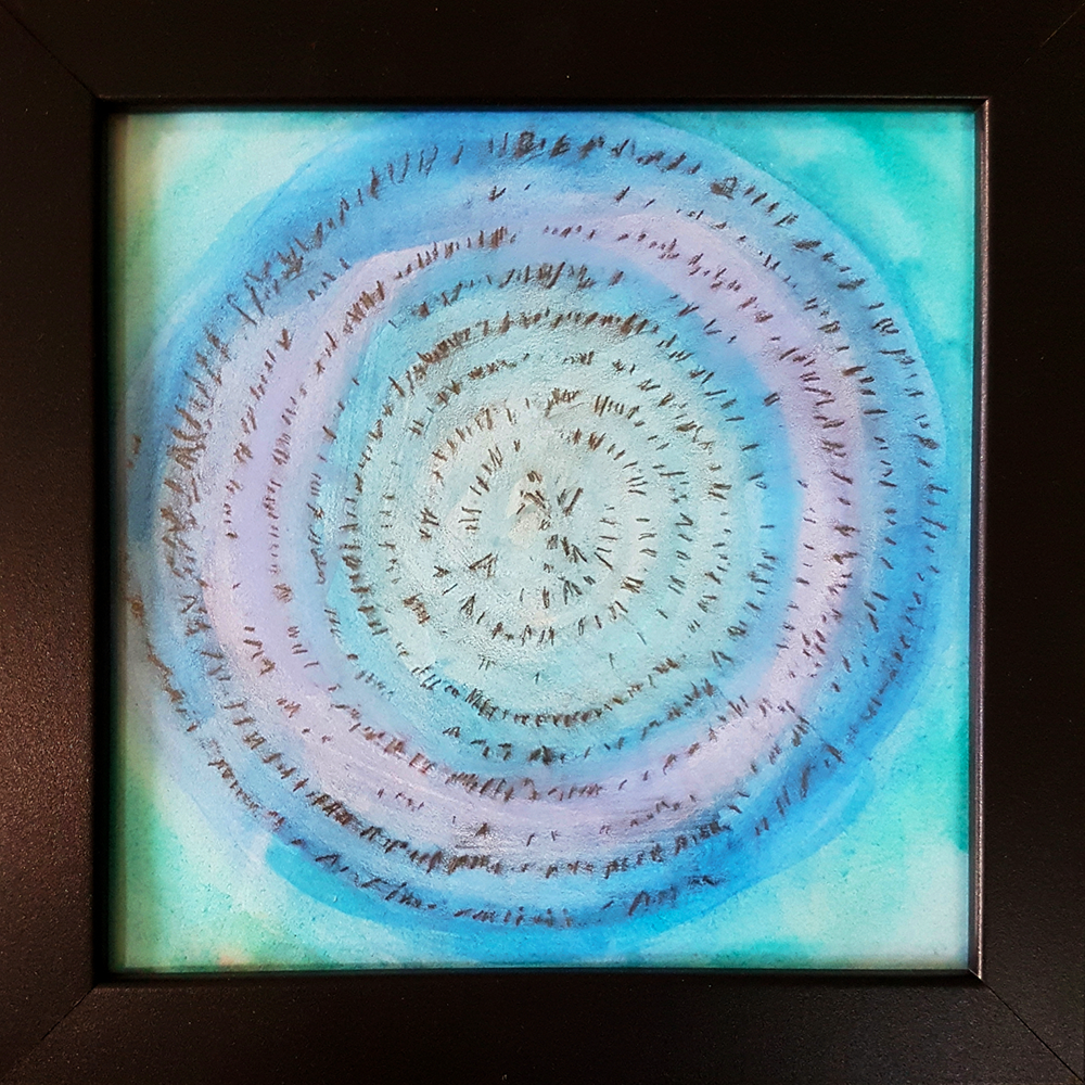 Framed artwork with concentric circular pattern in blue and green tones.