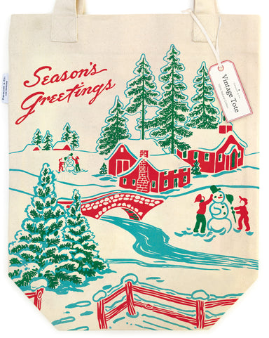 Cavallini & Co. Christmas Winter Wonderland Tote Bag- detail of tote bag with Christmas design featuring trees, houses, and people making a snowman.