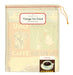 Vintage-themed tea towel with coffee graphics and text in a drawstring bag.