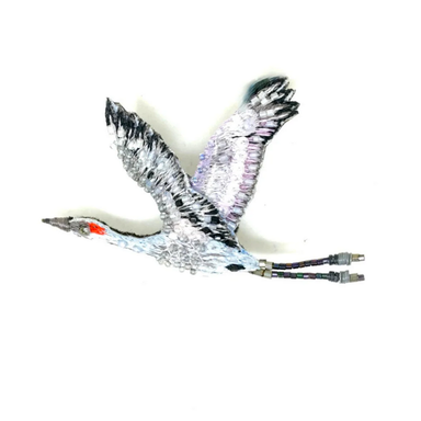 Sanhill Crane in flight beaded brooch with metallic sheen on a white background