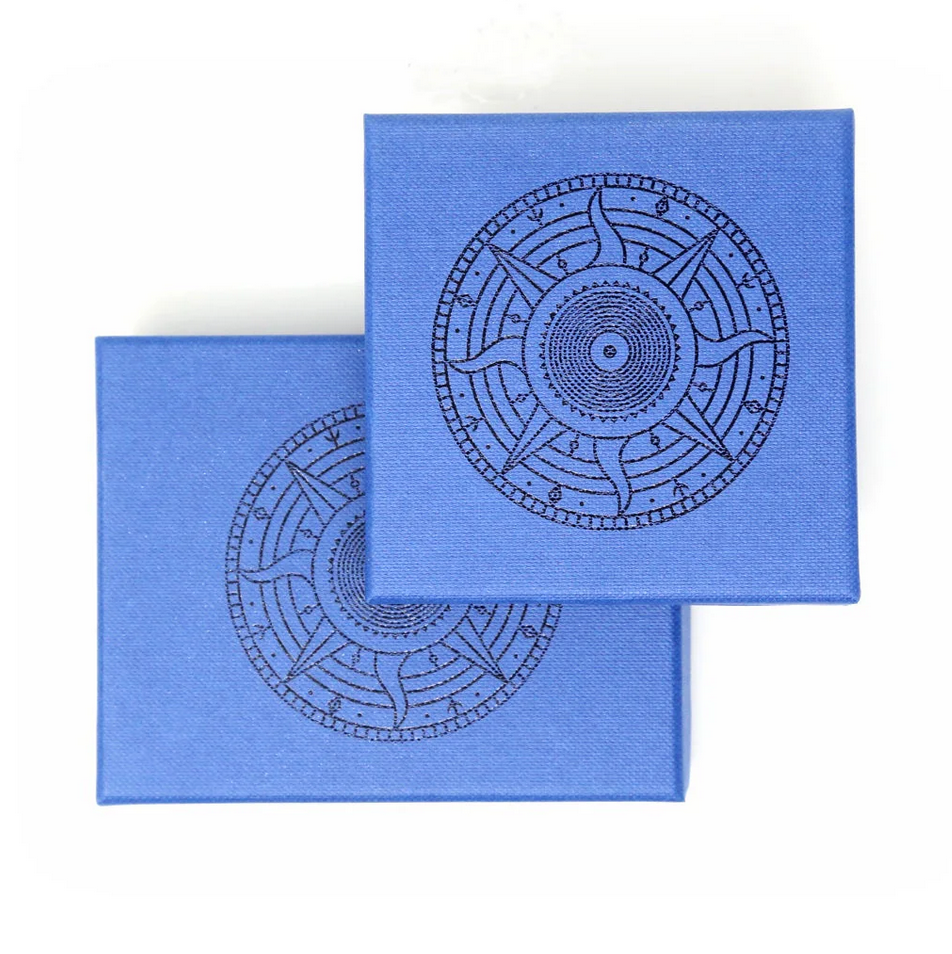 Blue gift box- showing 2 sizes with debossed sun compass image on lids