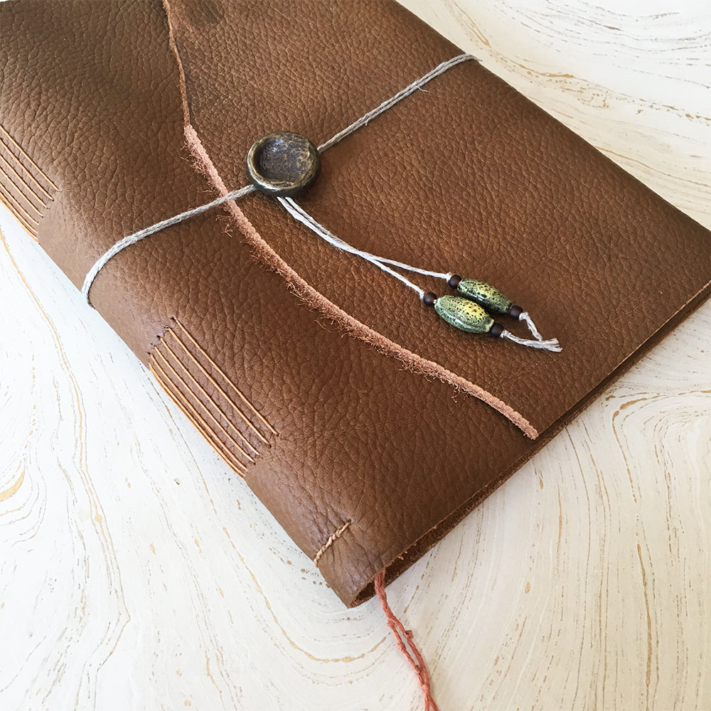 Medieval Leather Journal class sample with string, button, and glass beads