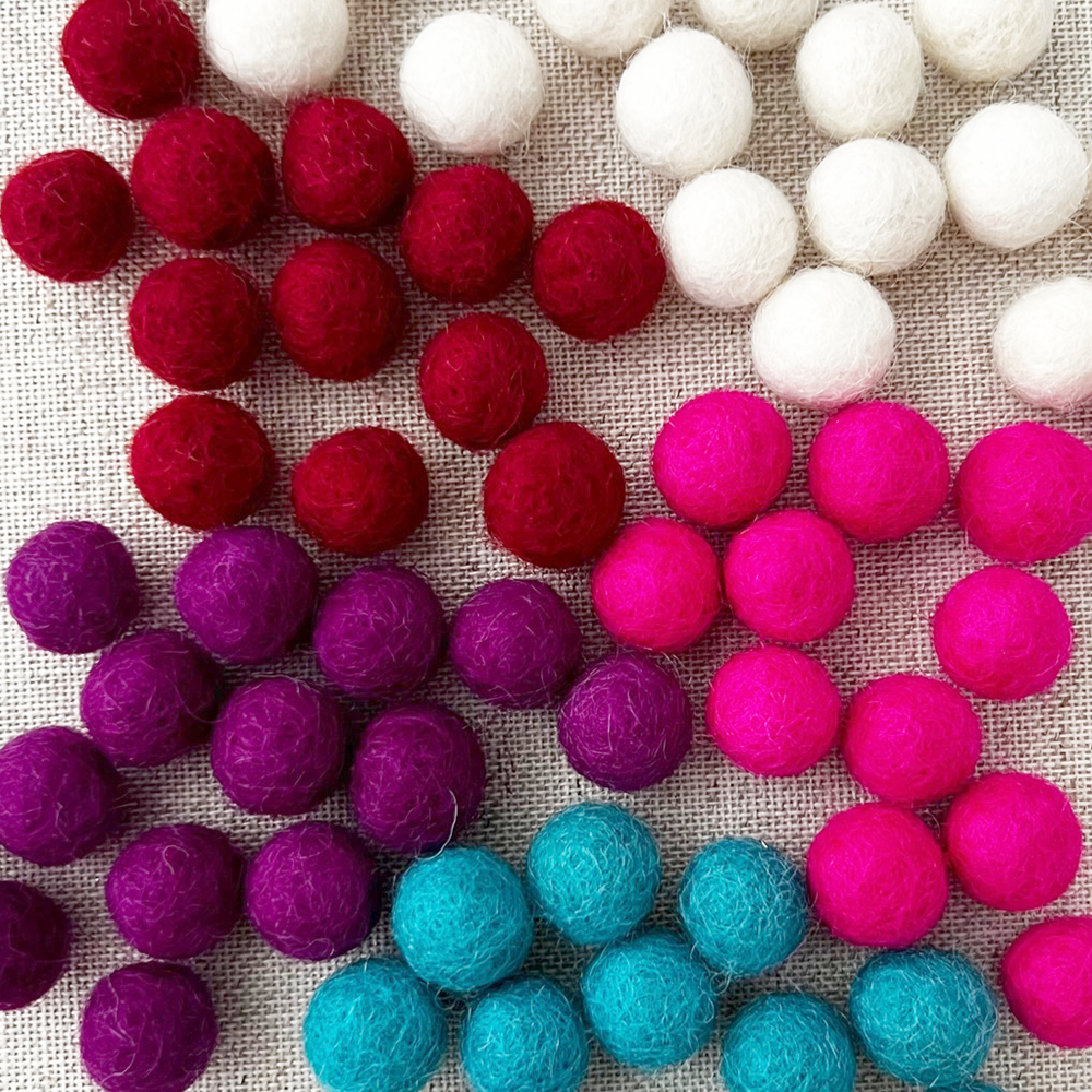 Wool Felt Pom Pom Balls - 1cm- shown in five colors- red, naturalm purplem turquoise, hot pink