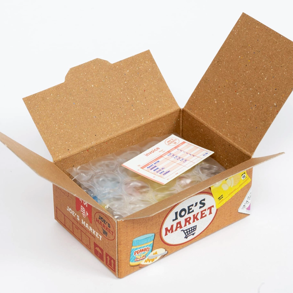 Open cardboard box with 'Joe's Market' branding on a white background