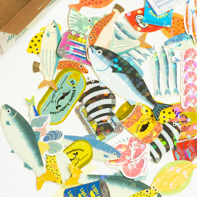 Collection of colorful fish-shaped stickers with various designs on a white background.
