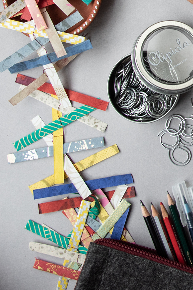 Organization. flat lay of paper scraps, pencils and paper clips