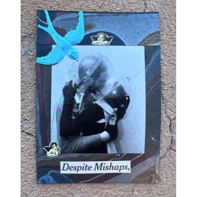 A square mixed-media collage titled 'Despite Mishaps,' featuring a central black-and-white photo of a couple embracing, a bright blue bird at the top left, small angel figures, and a dark patterned border, displayed on a textured concrete surface.